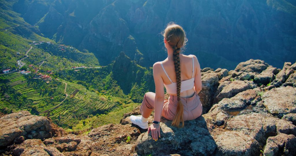 Woman admiring the view of the villge of Masca